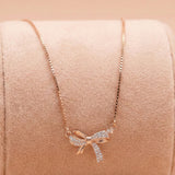 92.5 Silver Rose Gold Plated Sparkling Bow Pendant with chain Ivanah Silver